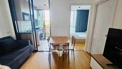 Modern apartment interior with open kitchen, dining area, and cozy living space.