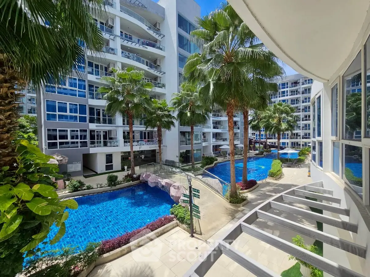 Luxurious residential complex with stunning pool and lush greenery