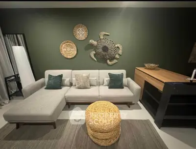 Stylish living room with modern sectional sofa and unique wall decor