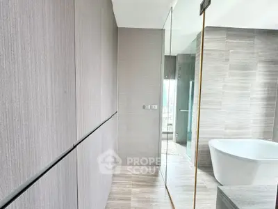 Luxurious modern bathroom with freestanding bathtub and sleek design