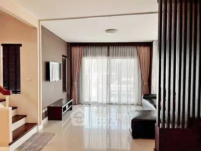 Spacious modern living room with sleek design and large windows for natural light.