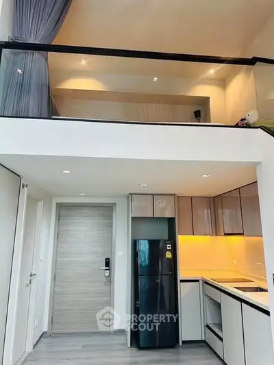 Modern loft apartment with sleek kitchen and stylish mezzanine