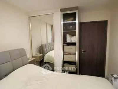 Cozy bedroom with mirrored wardrobe and modern decor