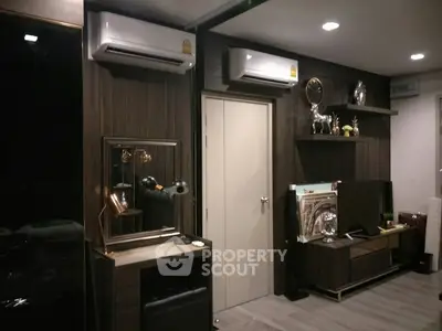 Modern living room with stylish decor and dual air conditioning units