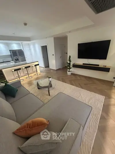 Modern living room with open kitchen and stylish decor