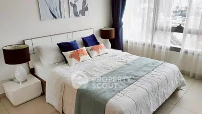 Elegant bedroom with city view, featuring stylish decor and natural light.