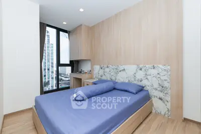 Modern bedroom with city view and stylish decor