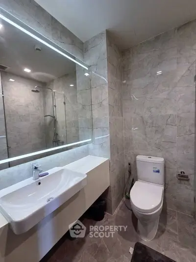 Modern bathroom with elegant marble tiles and sleek fixtures