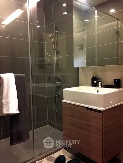 Modern bathroom with sleek glass shower and stylish vanity unit