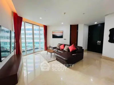 Luxurious living room with modern decor and large windows offering stunning city views.