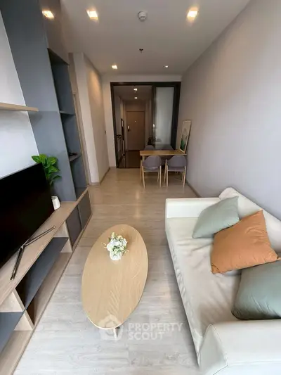 Modern living room with sleek furniture and open layout, perfect for urban living.