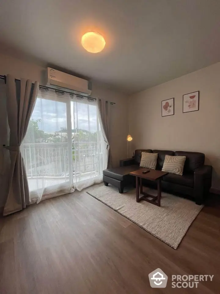 Cozy living room with balcony view, modern sofa, and ambient lighting