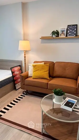 Stylish living room with cozy sofa, modern decor, and warm lighting in a contemporary apartment.