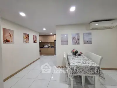 Modern dining area with elegant decor and open kitchen layout