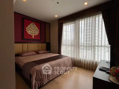 Elegant bedroom with large window and stylish decor in modern apartment