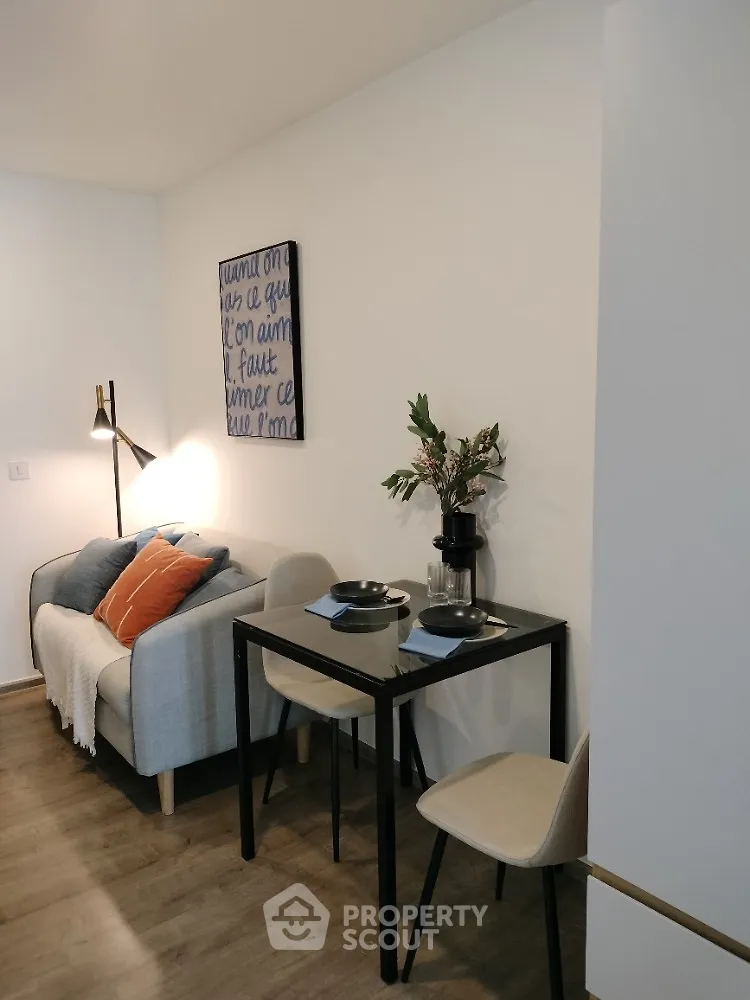 Cozy living room with modern decor and dining area in stylish apartment