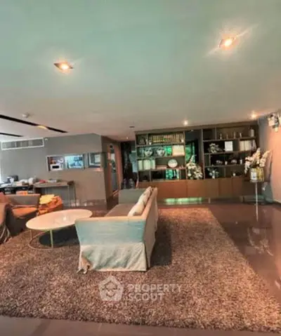 Spacious modern living room with elegant decor and cozy seating area.