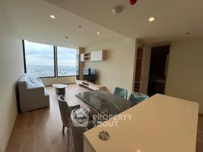 Spacious modern living room with city view and stylish furniture