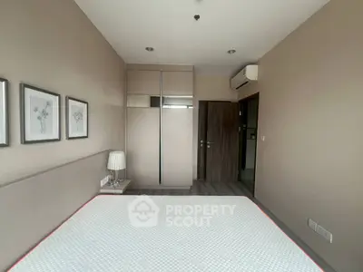 Modern bedroom with minimalist design and air conditioning unit