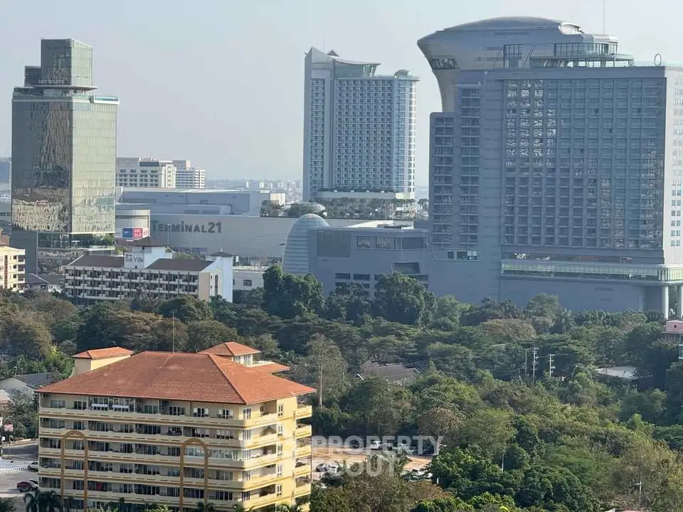 Stunning cityscape view showcasing modern high-rise buildings and lush greenery, perfect for urban living.