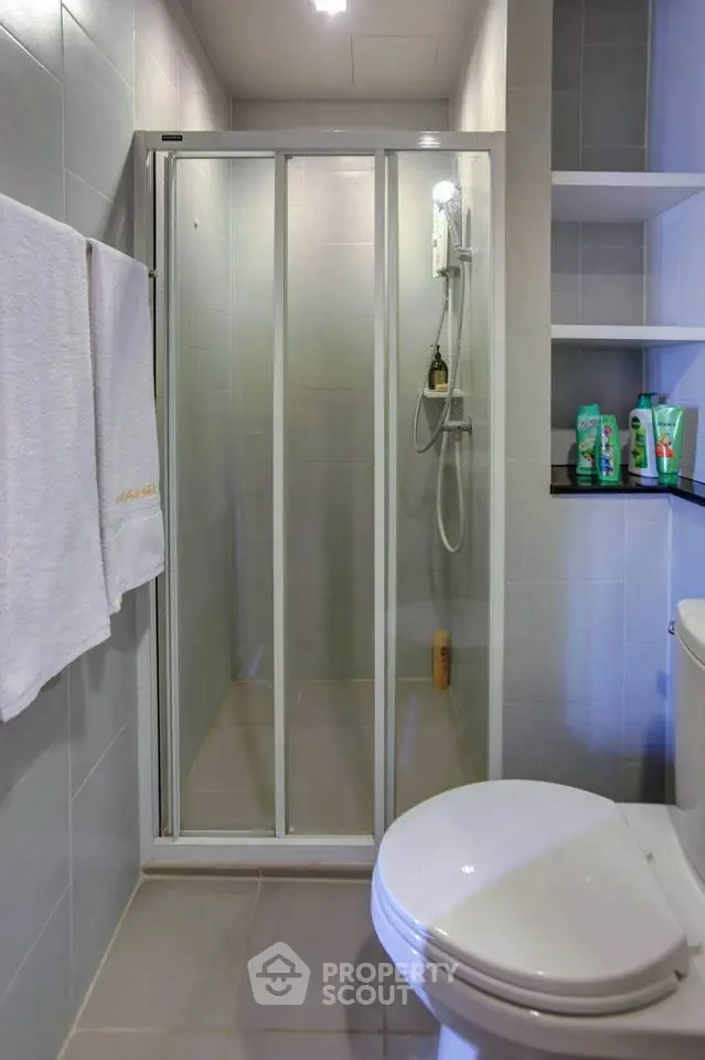 Modern bathroom with glass shower enclosure and sleek design
