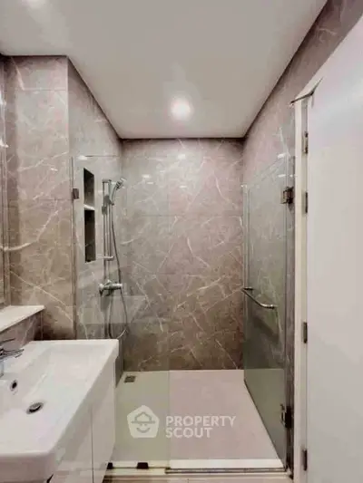 Modern bathroom with sleek design and glass shower enclosure