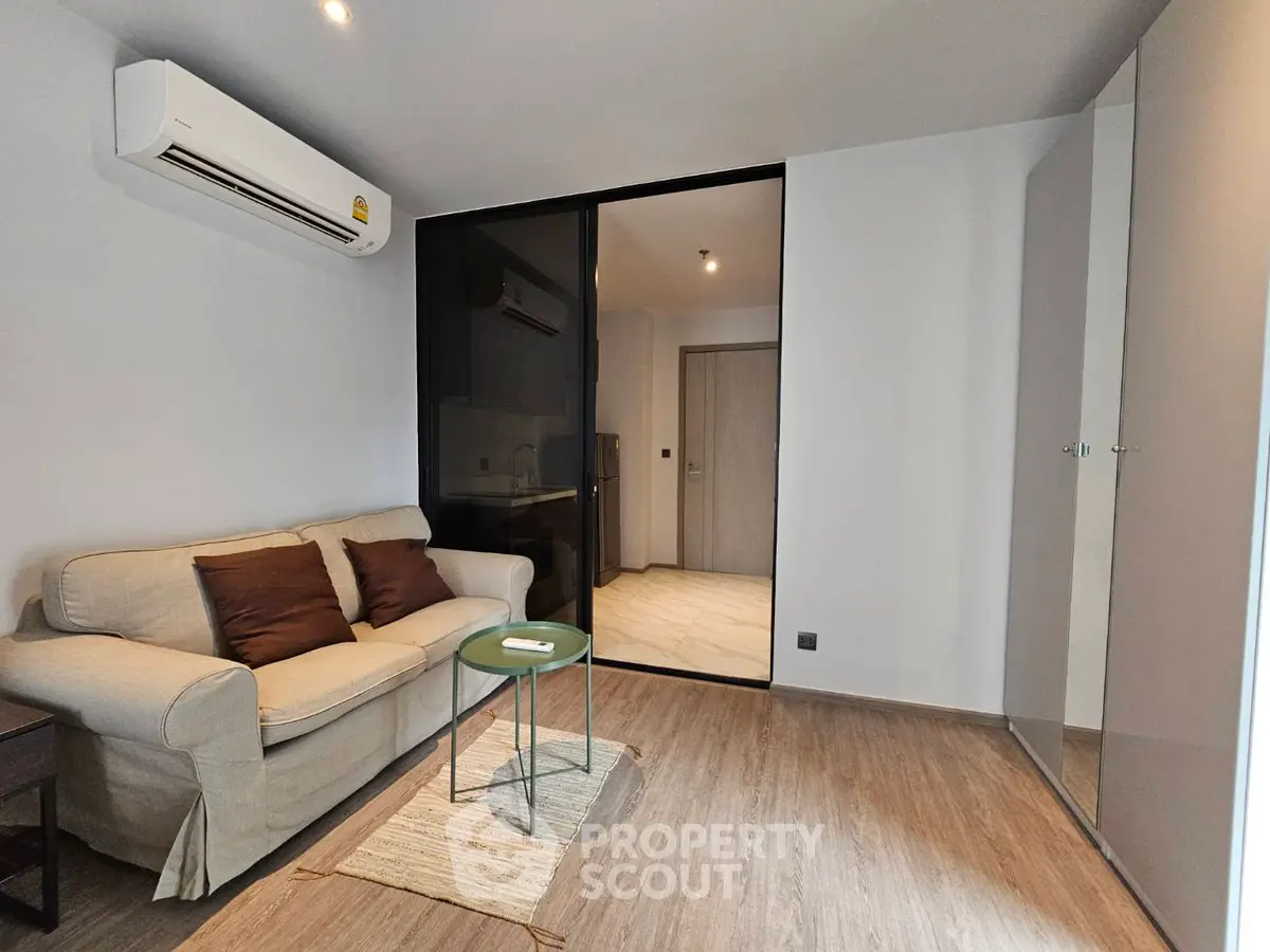Modern living room with air conditioning and stylish furniture in a cozy apartment.