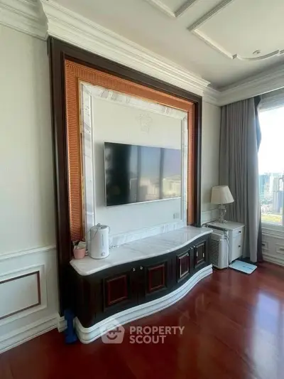 Luxurious living room with elegant TV setup and city view