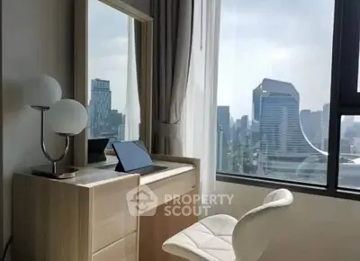 Modern study area with city view, featuring sleek desk and chair, ideal for productivity.