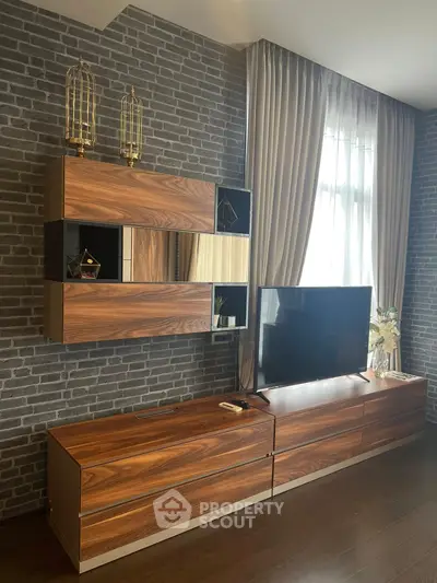 Modern living room with stylish wooden furniture and brick accent wall