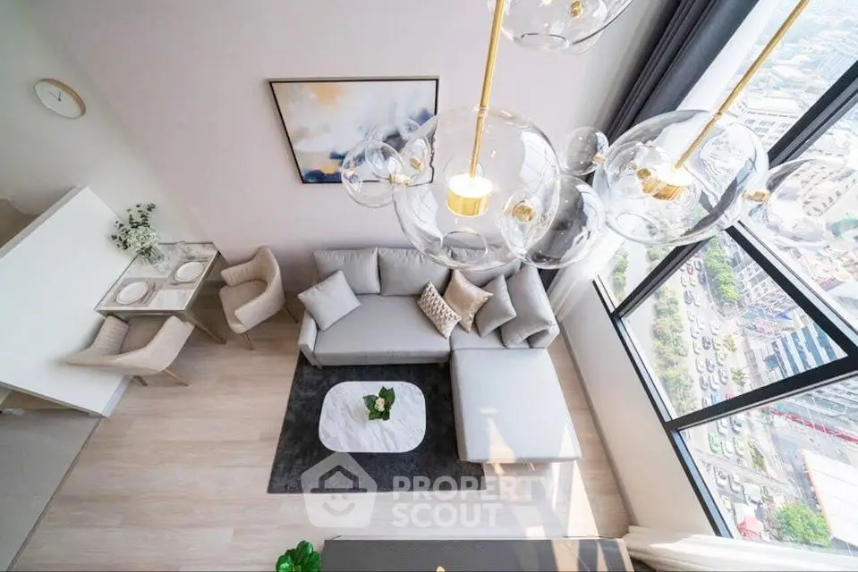 Luxurious modern living room with high ceiling and stunning city view, featuring elegant decor and stylish furniture.