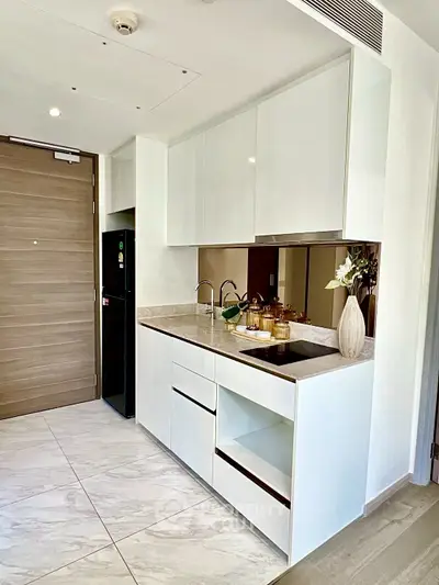 Modern kitchen with sleek white cabinets and elegant marble flooring