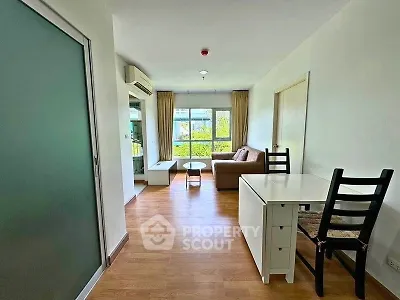 Bright and airy living room with modern furnishings and large windows.