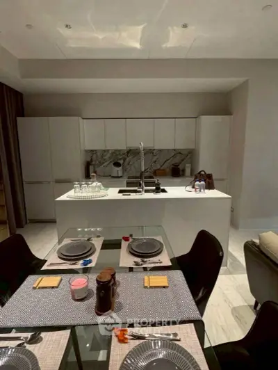 Modern kitchen with sleek design and elegant dining setup