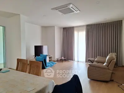 Spacious living room with modern furniture and natural light