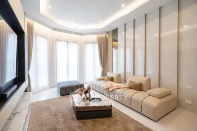 Luxurious modern living room with elegant decor and large windows