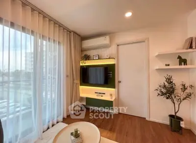 Modern living room with stylish decor and large window view