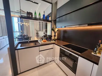 Modern kitchen with sleek design and open layout, featuring built-in appliances and stylish decor.