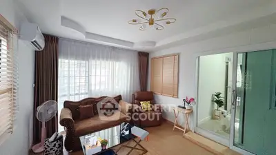 Charming living room with cozy seating and elegant decor, perfect for relaxation and entertaining.