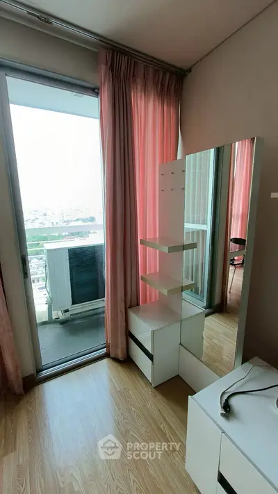 Modern bedroom with balcony access and stylish furniture