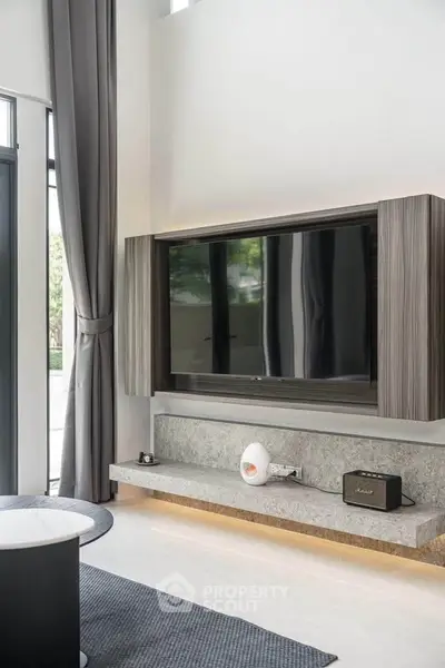 Modern living room with sleek TV setup and stylish decor