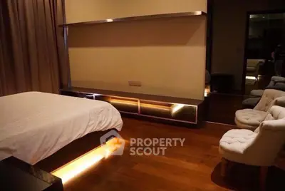 Luxurious bedroom with ambient lighting and elegant furnishings