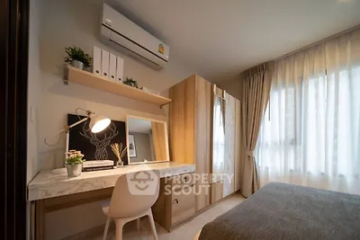 Cozy bedroom with stylish decor and ample natural light
