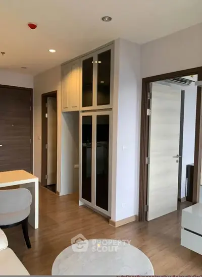 Modern apartment interior with wooden flooring and sleek furniture design