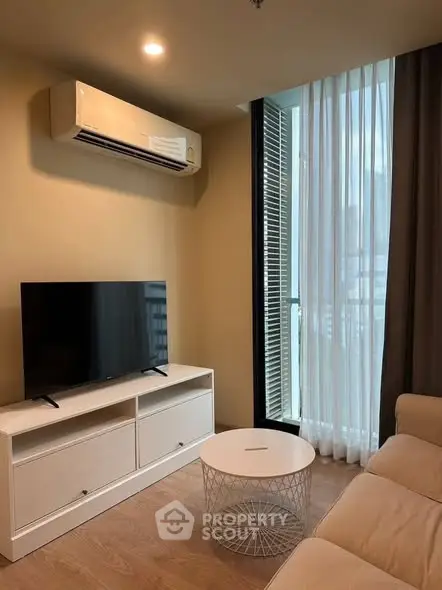 Modern living room with air conditioning and balcony view