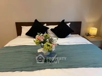 Cozy bedroom with elegant decor and soft lighting, perfect for relaxation.