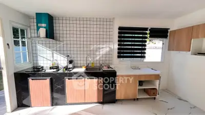 Modern kitchen with sleek black marble countertops and wooden cabinets