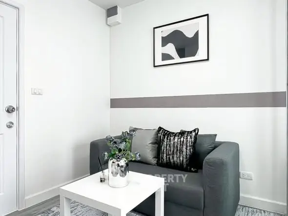 Modern living room with stylish decor and cozy seating area.