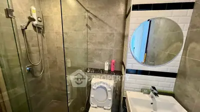 Modern bathroom with glass shower and sleek fixtures