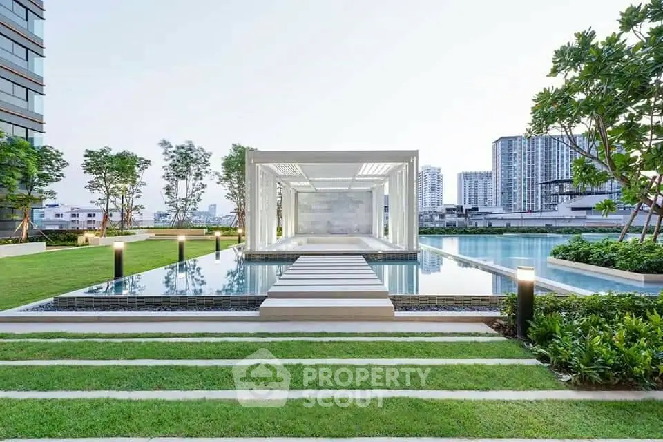 Luxurious modern garden with pool and cityscape view, perfect for urban living.